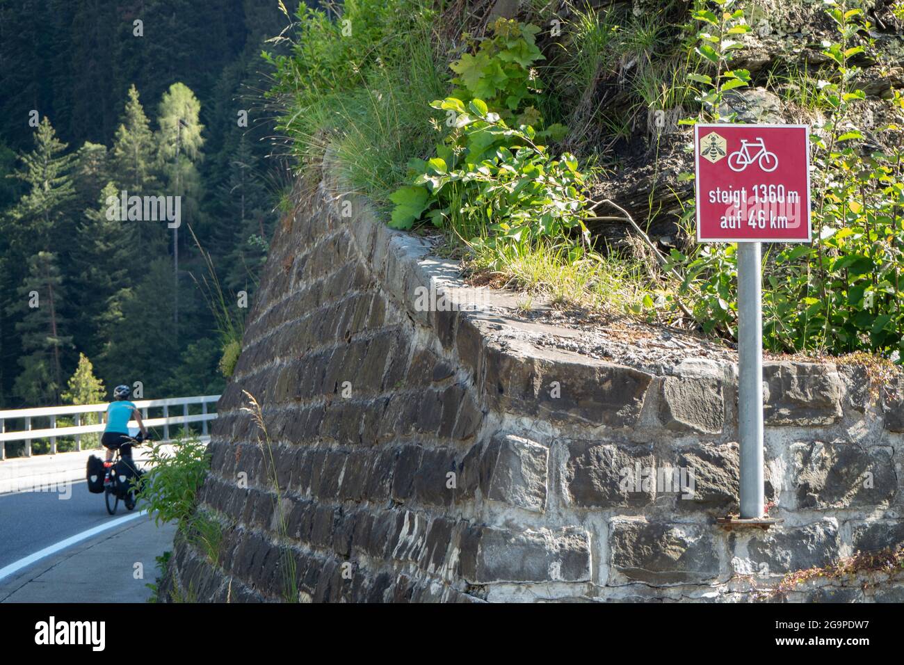 Until 1360m rise to San Bernardino. A cyclist departs in Thusis, Switzerland Stock Photo