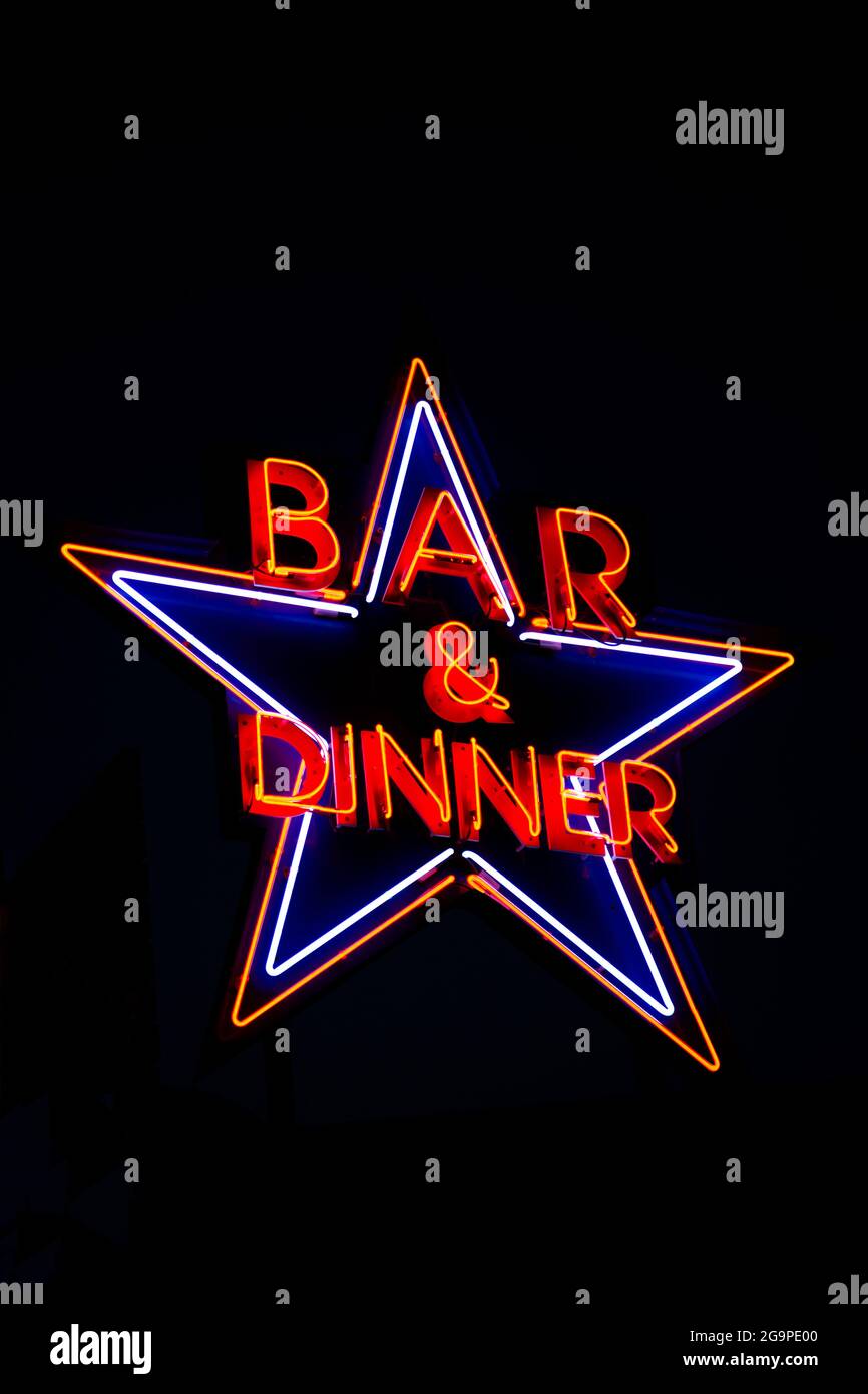 Neon sign of bar and dinner at night Stock Photo