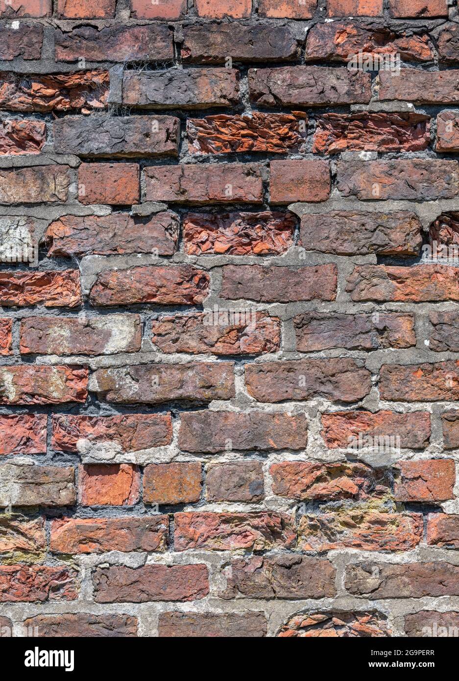 crumbling historic old red brick wall, red brick wall falling down