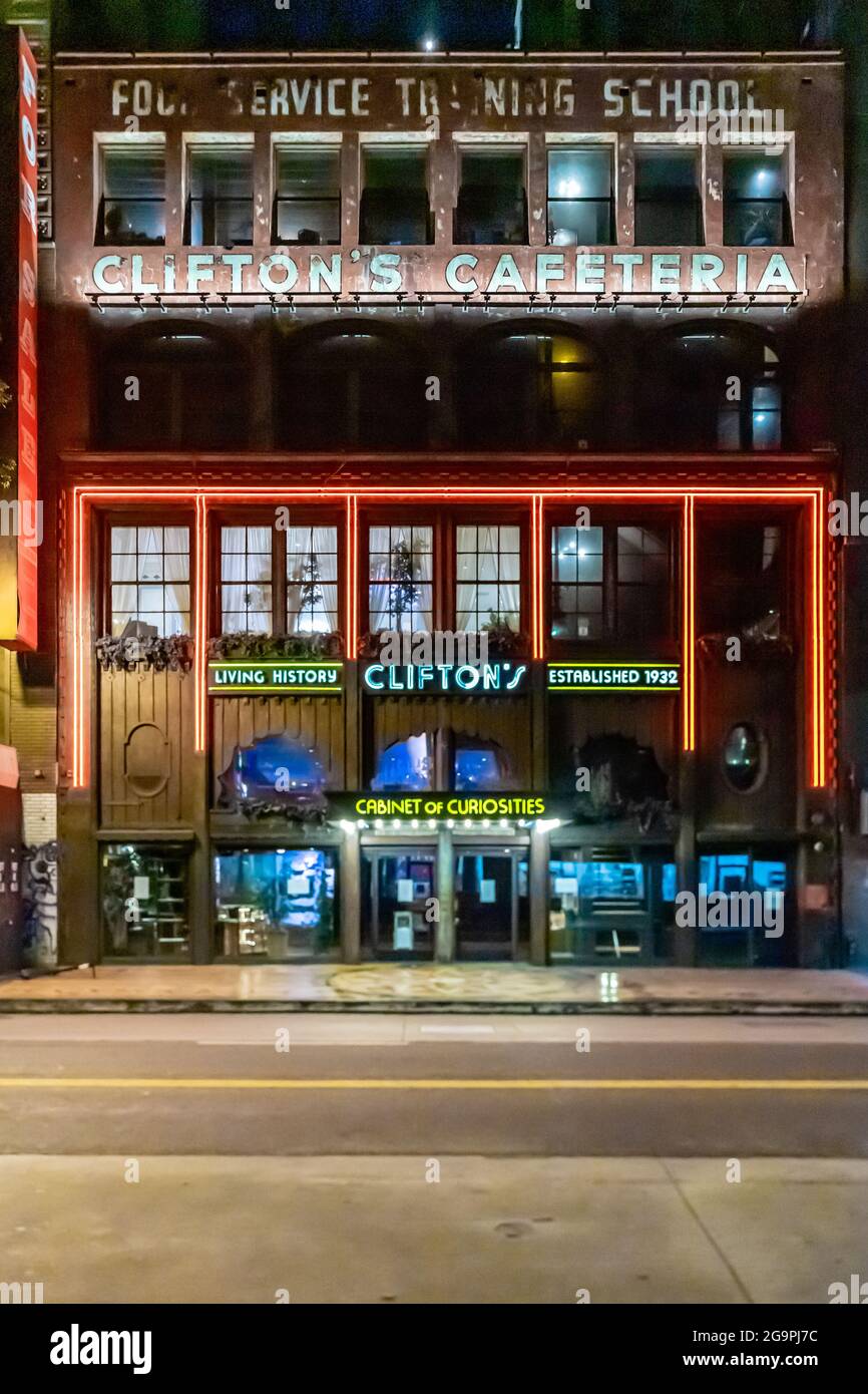 Clifton's Cafeteria front lit up at night; it was the oldest cafeteria-style eatery in Los Angeles before being shut in 2018; 648 S Broadway, LA, CA Stock Photo