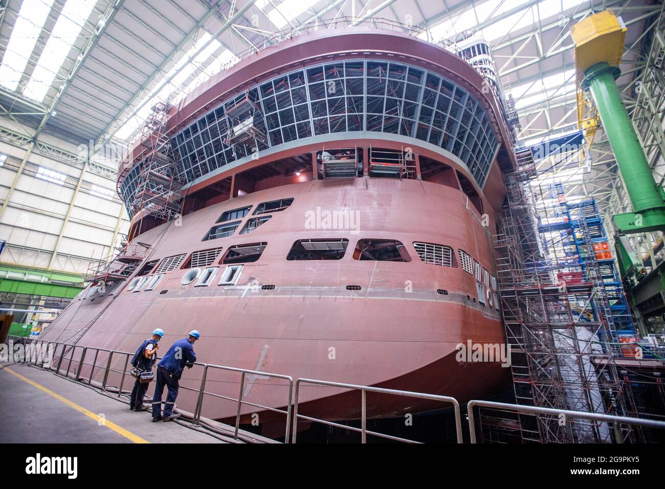 Wismar Germany 14th July 2021 Shipbuilders Watch The Assembly Of The Ship S Propulsion System At The Stern Of The Global Dream Cruise Ship Under Construction In The Dock Of The Mv Shipyard