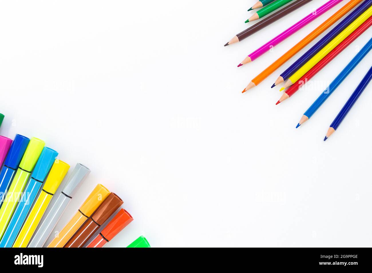 Colored pencils and markers against each other Stock Photo by ©Popoudina  81852286