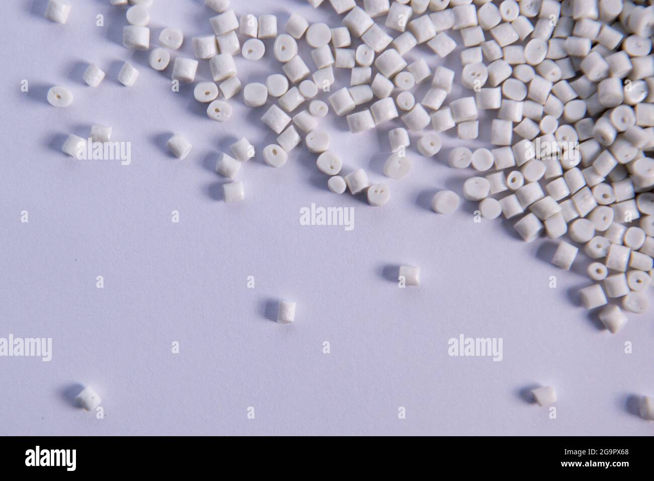 Polypropylene granule close-up background texture. plastic resin ( Masterbatch).Grey chemical granules for industrial plastic production Stock Photo