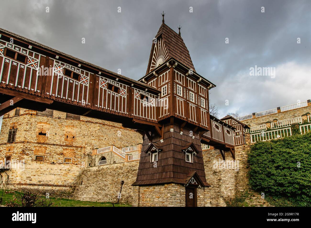 Old carved wooden Jurkovic bridge with charming castle tower in Nove Mesto nad Metuji, pearl of Eastern Bohemia, Czech Republic.Czech renaissance Stock Photo