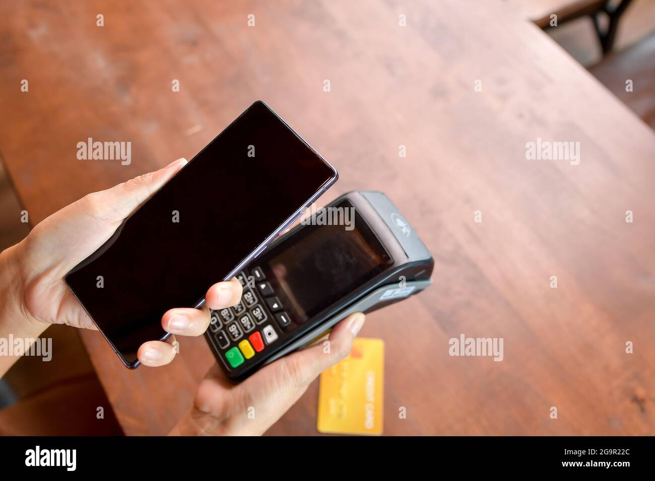 Costumer scanning phone to pay.Contactless payment method. Stock Photo