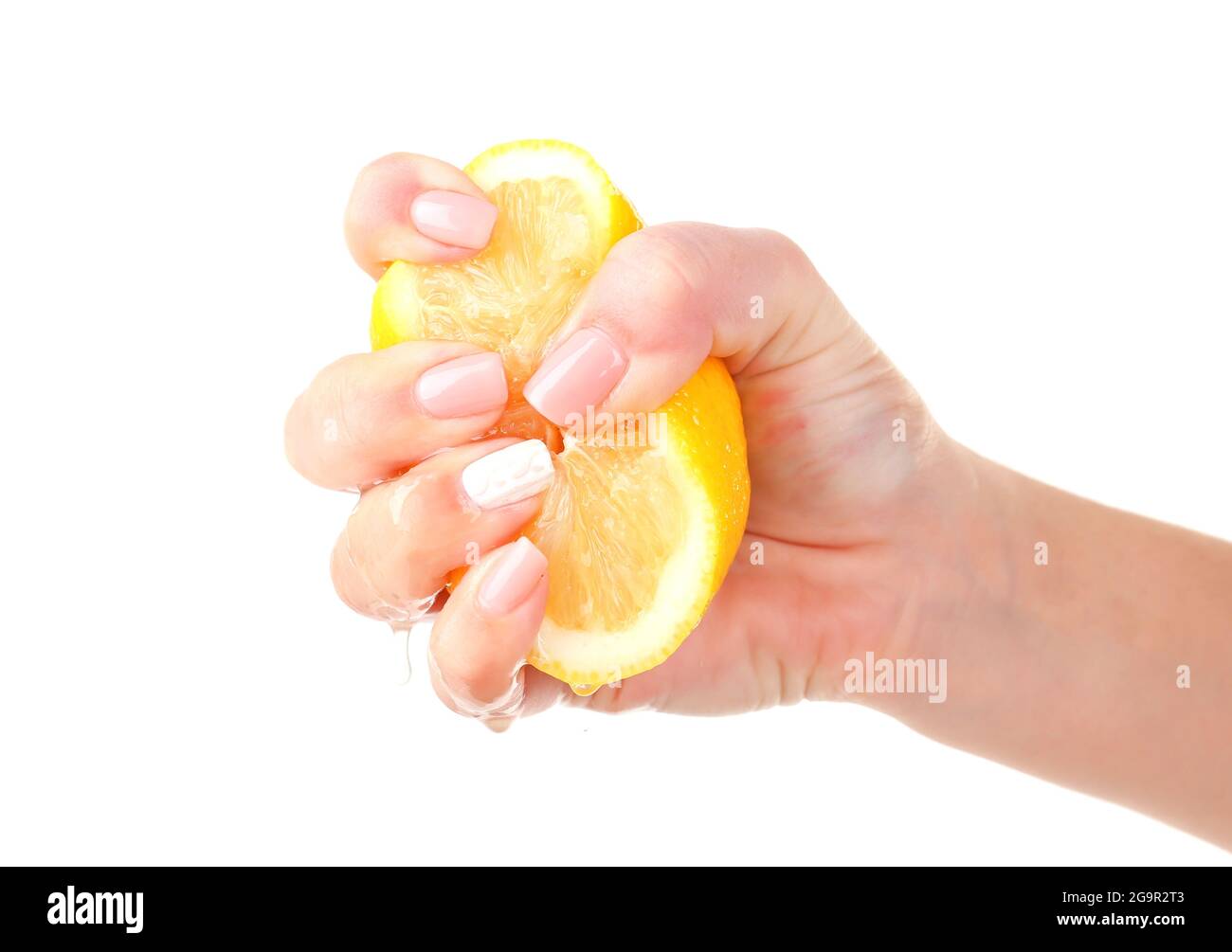 Female hand squeezing lemon isolated on white Stock Photo Alamy