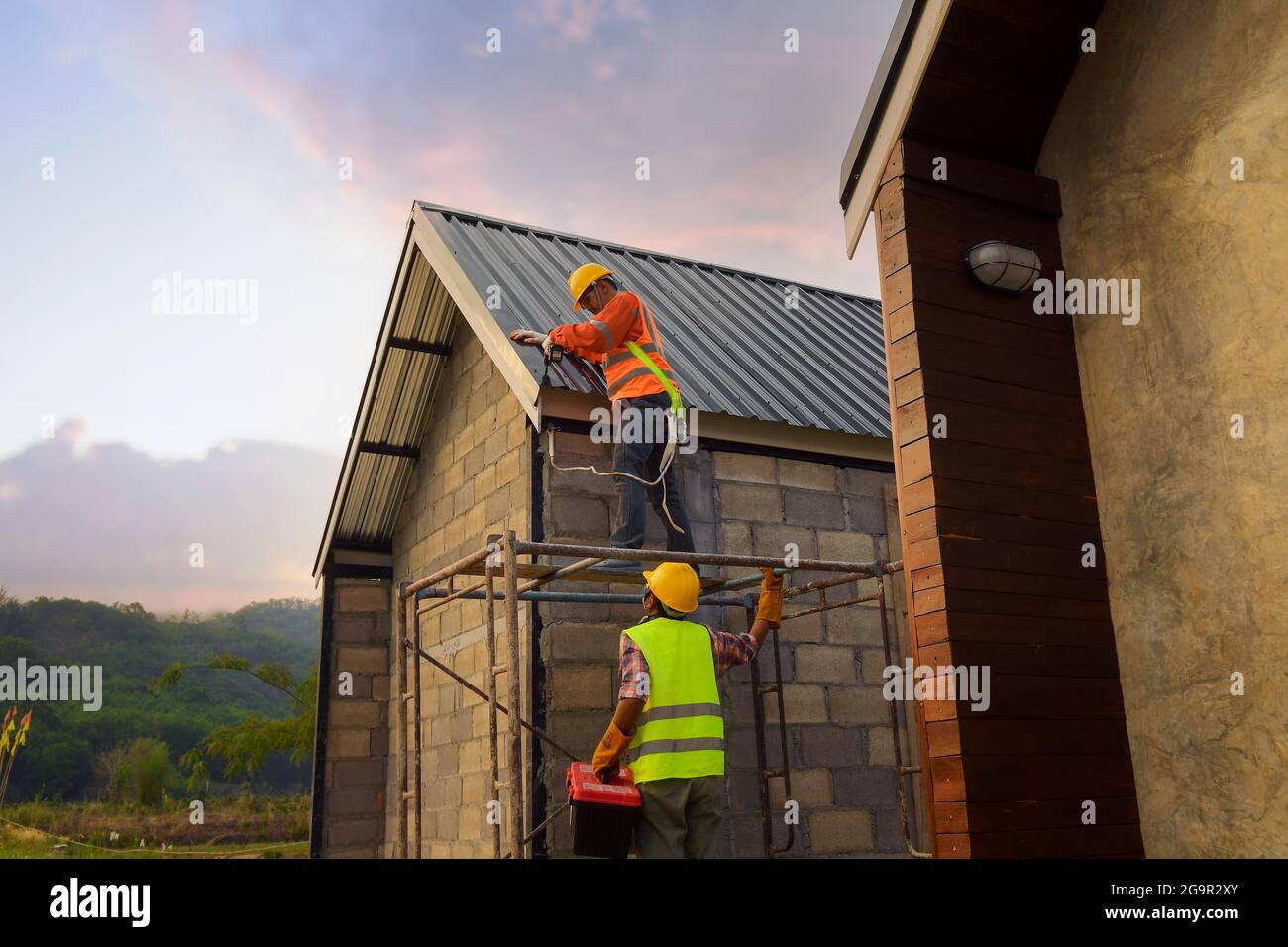 Roofer Construction worker install new roof,Roofing tools,Electric drill used on new roofs with