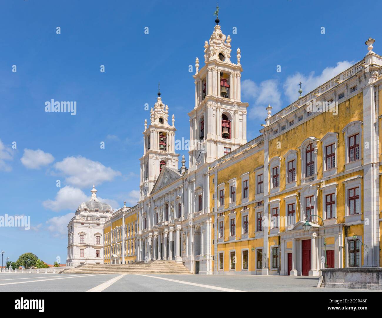 The main facade of The Palace of Mafra, Lisbon district, Portugal.  It is also known as the Palace-Convent of Mafra and the Royal Building of Mafra. Stock Photo