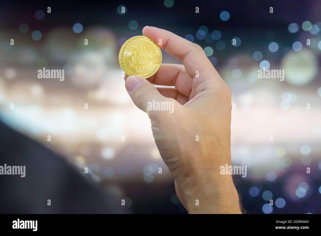 Bitcoin on a coin held by a hand. The is the leading cryptocurrency in the  financial world is the favorite asset for invesment and store of valure. Bi  Stock Photo - Alamy
