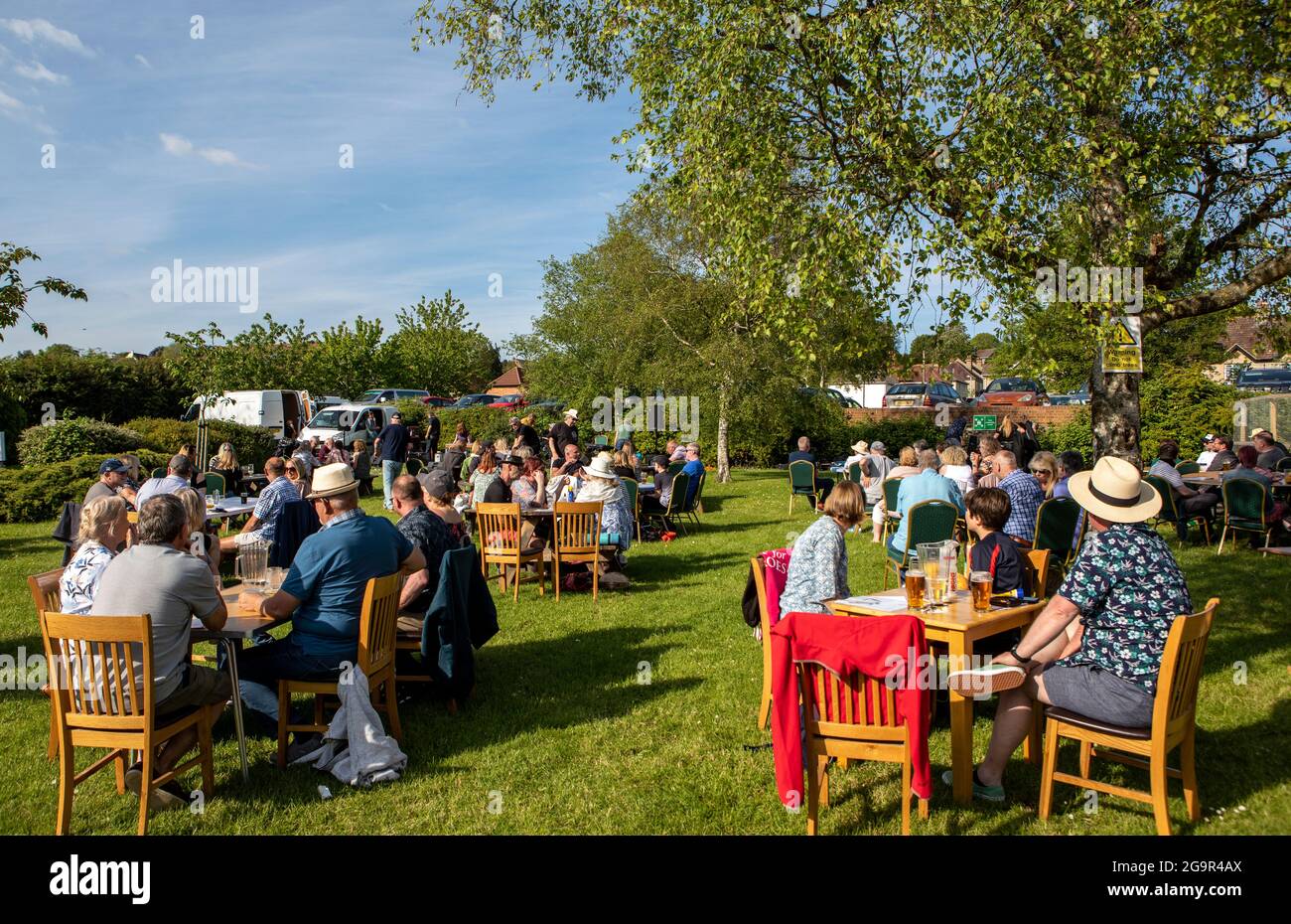 People Sitting in A pub Garden In Salisbury Wilts UK Stock Photo
