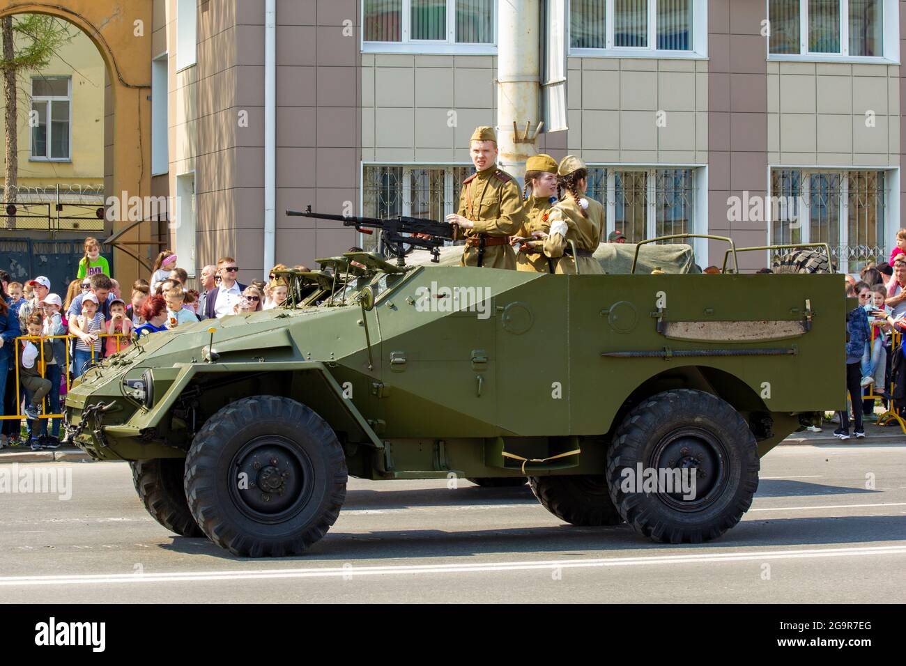 Omsk, Russia. 9 May, 2021. The armored transporter GAZ-40 or BTR-40 moves through the parade square of the city. Russian parade of military equipment Stock Photo