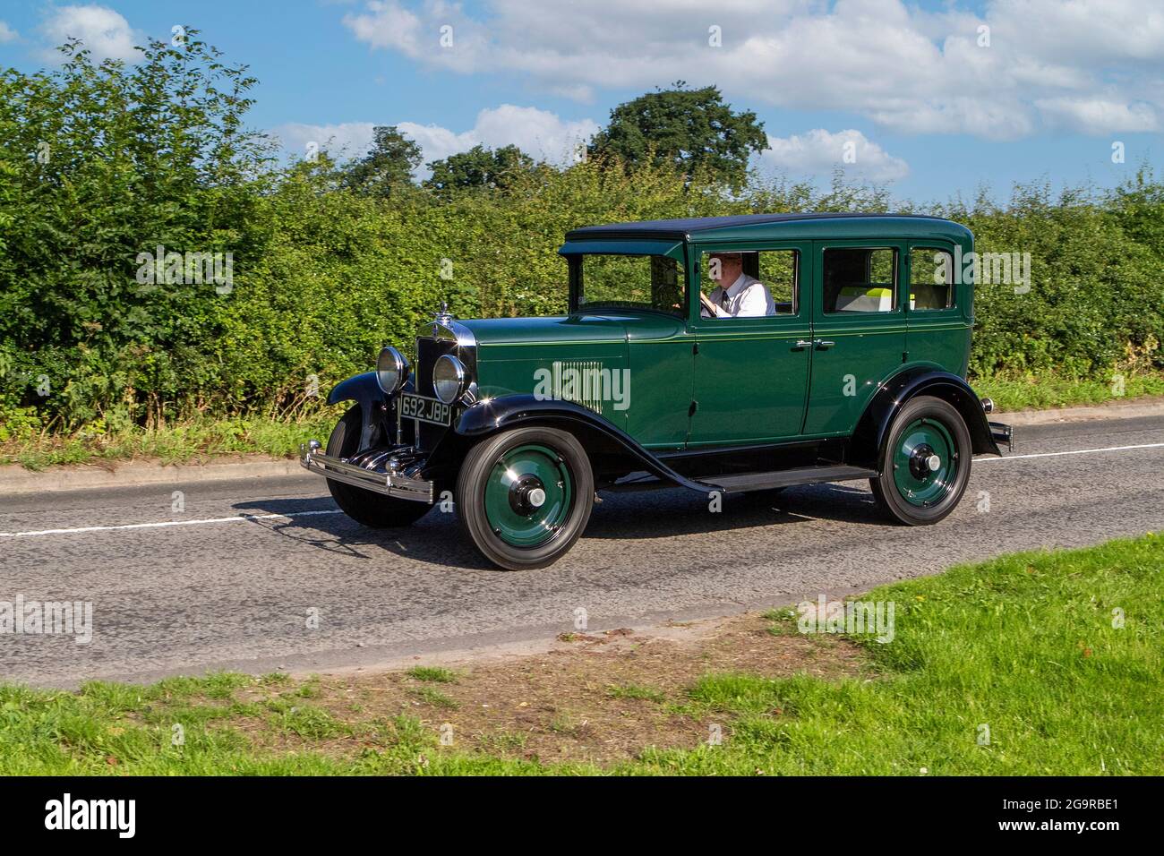 1929 20s pre-war green  CHEVROLET INT. AC. 3137cc petrol vehicle en-route to Capesthorne Hall classic July car show, Cheshire, UK Stock Photo