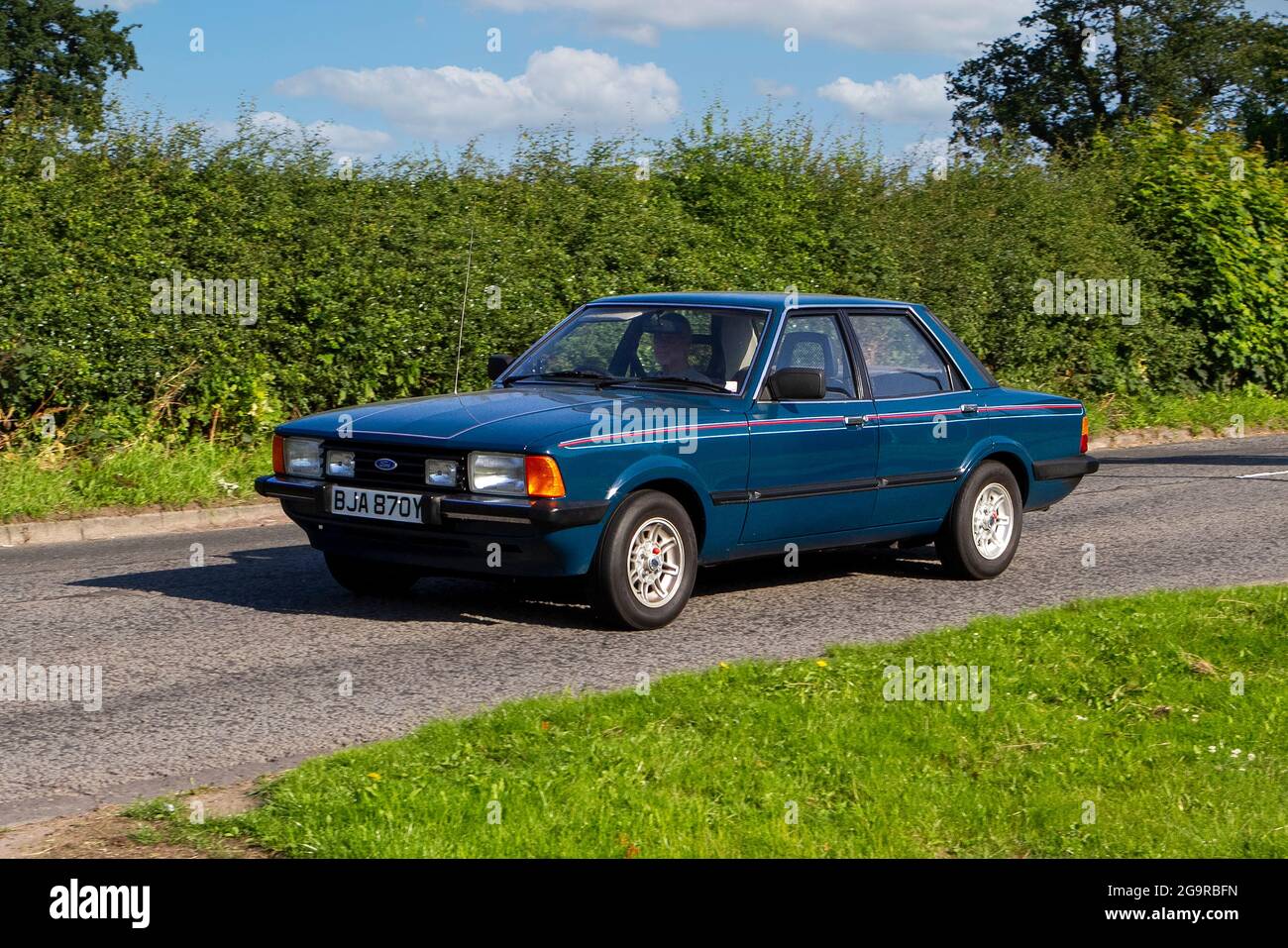1982 80s blue Ford Cortina vehicle en-route to Capesthorne Hall classic July car show, Cheshire, UK Stock Photo