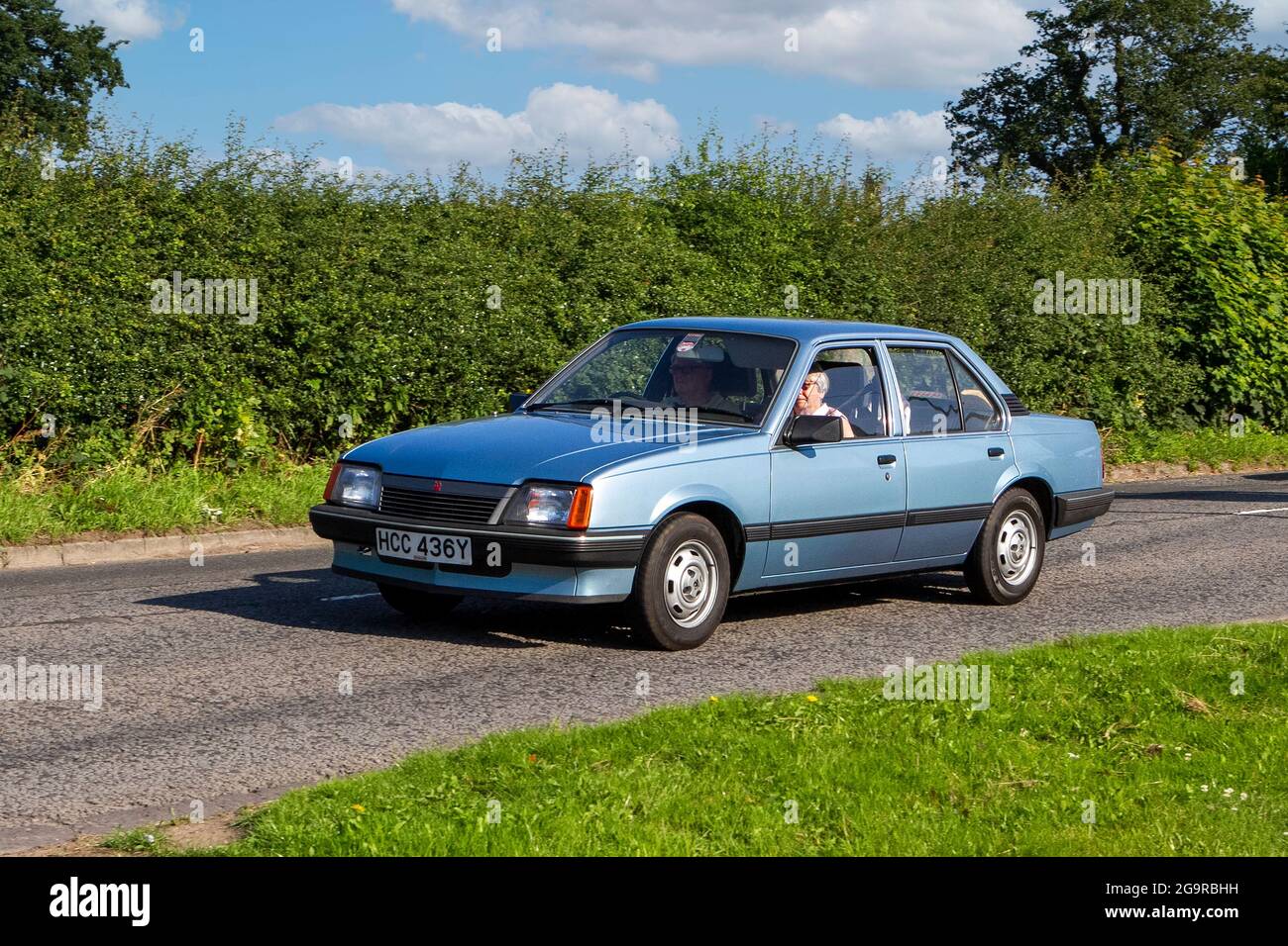 1983 80s blue British Vauxhall Cavalier 1598 cc vehicle en-route to Capesthorne Hall classic July car show, Cheshire, UK Stock Photo