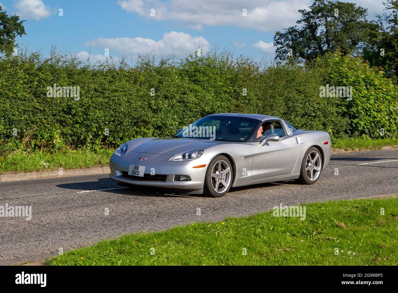 2005 silver Chevrolet Corvette 2dr  5987 cc, vehicle en-route to Capesthorne Hall classic July car show, Cheshire, UK Stock Photo