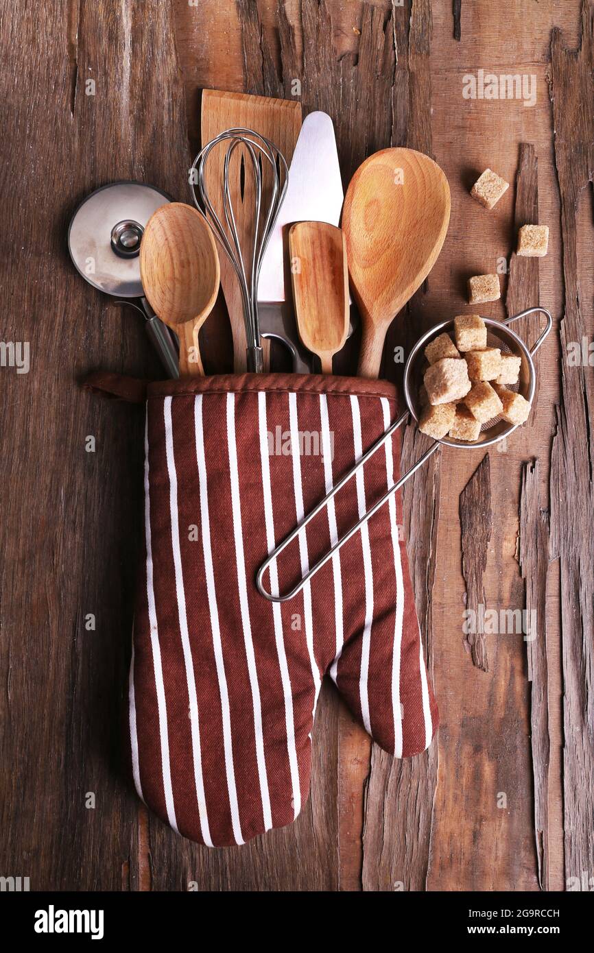 Set of kitchen utensils on rustic wooden table background Stock Photo ...