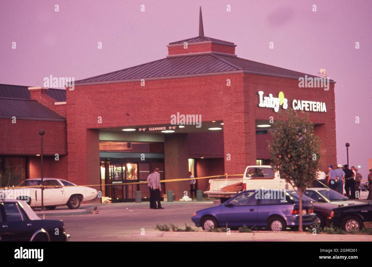 Killeen Texas USA, October 16,1991: Police investigators work at the crime scene of a mass shooting at Luby's Cafeteria in Killeen. George Hennard, a 35-year-old Killeen resident, crashed a pickup into the eatery and shot 23 people to death before killing himself. ©Bob Daemmrich Stock Photo