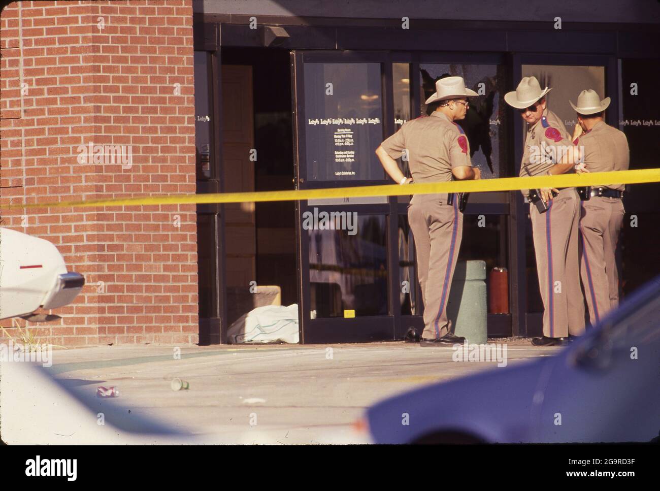 Killeen Texas USA, October 16,1991: Police investigators work at the crime scene of a mass shooting at Luby's Cafeteria in Killeen. George Hennard, a 35-year-old Killeen resident, crashed a pickup into the eatery and shot 23 people to death before killing himself. ©Bob Daemmrich Stock Photo
