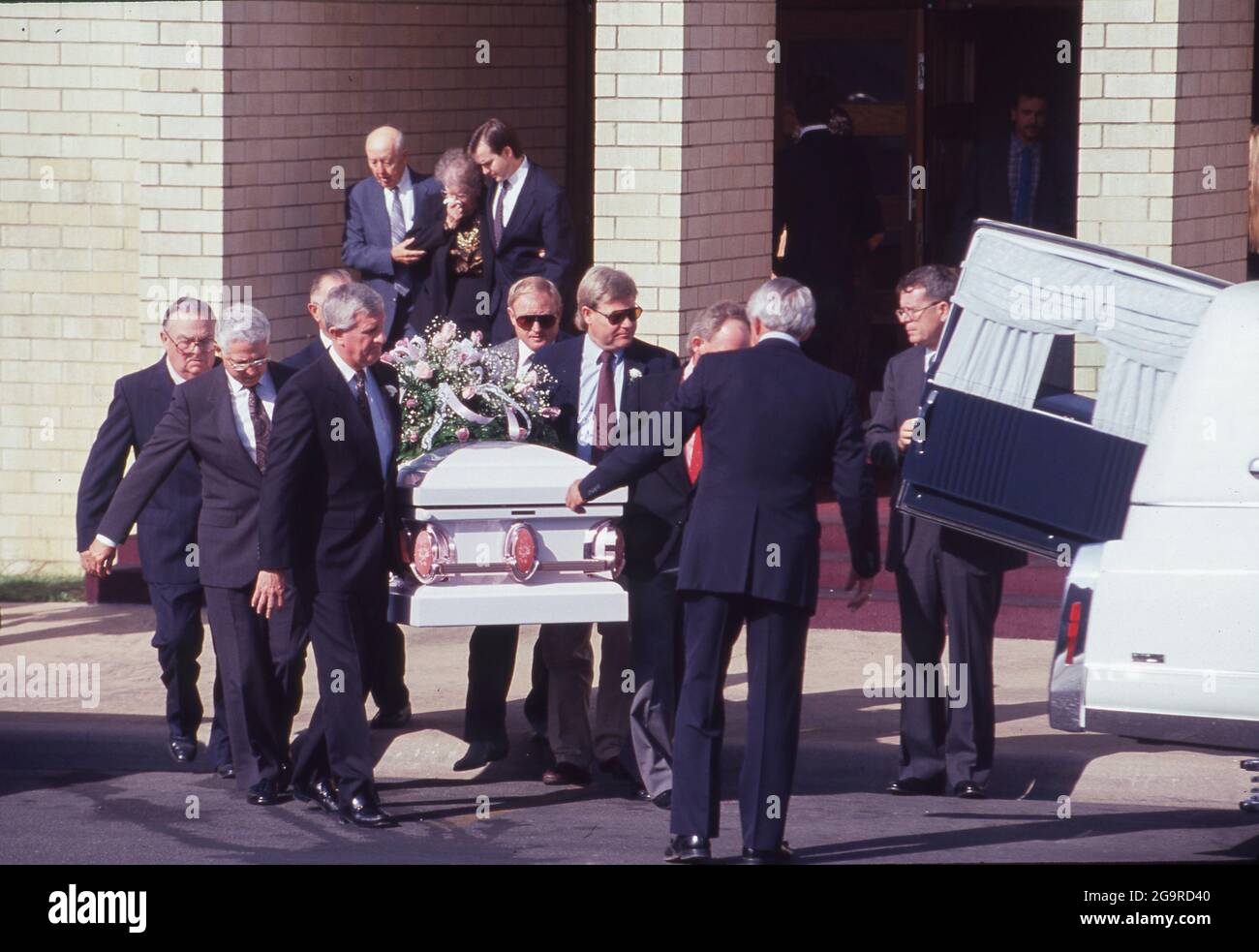 Killeen Texas USA, October 1991: Mourners attend a funeral service for one of the victims of a mass shooting at Luby's Cafeteria in Killeen. on October 16. George Hennard, a 35-year-old Killeen resident, crashed a pickup into the eatery and shot 23 people to death before killing himself. ©Bob Daemmrich Stock Photo