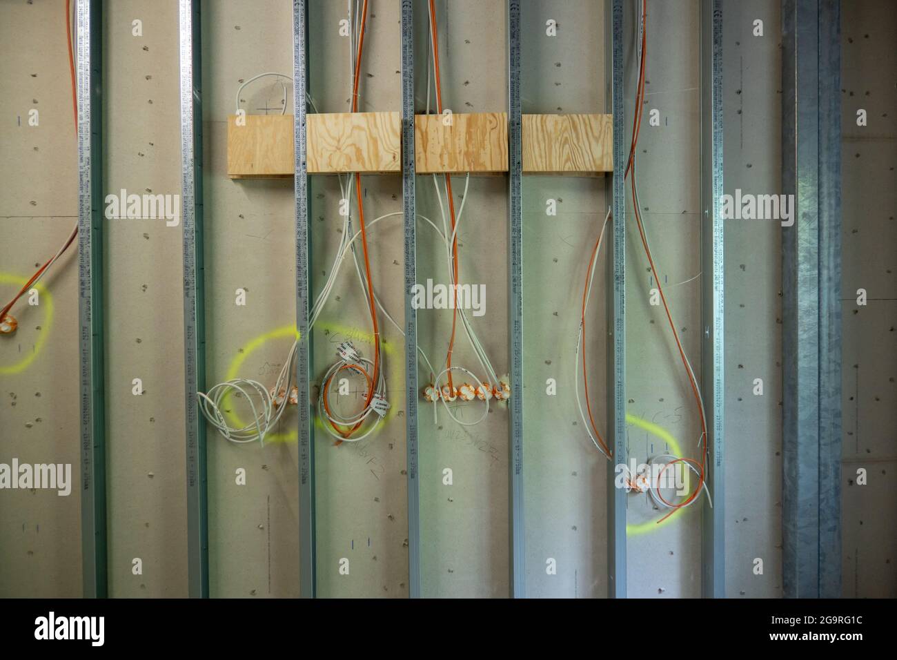in a drywall run the power cables for the sockets Stock Photo Alamy