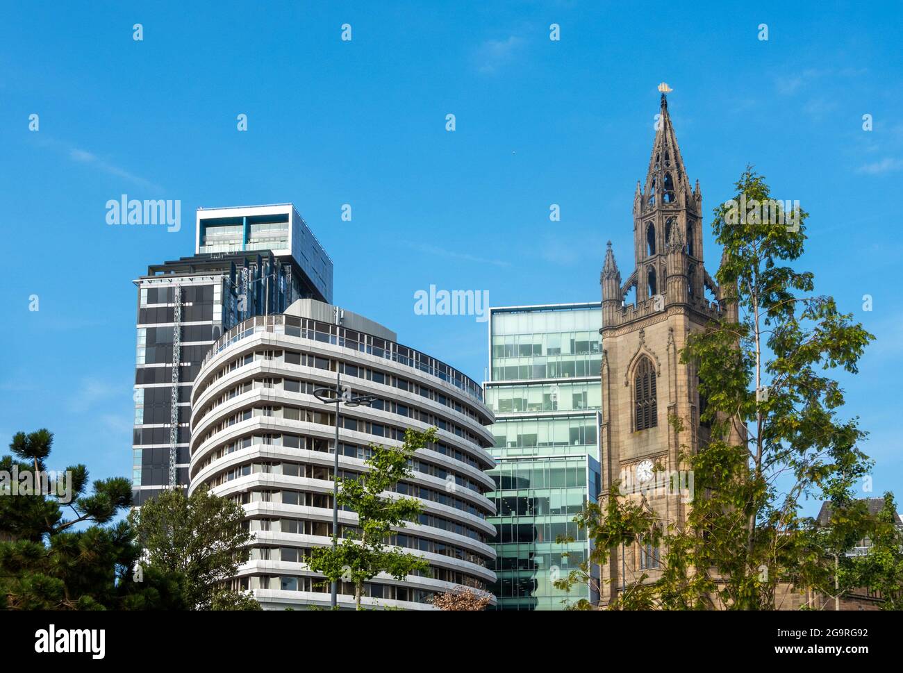 The Church of Our Lady and Saint Nicholas, the Anglican parish church of Liverpool standing next to a mix of modern buildings. Stock Photo