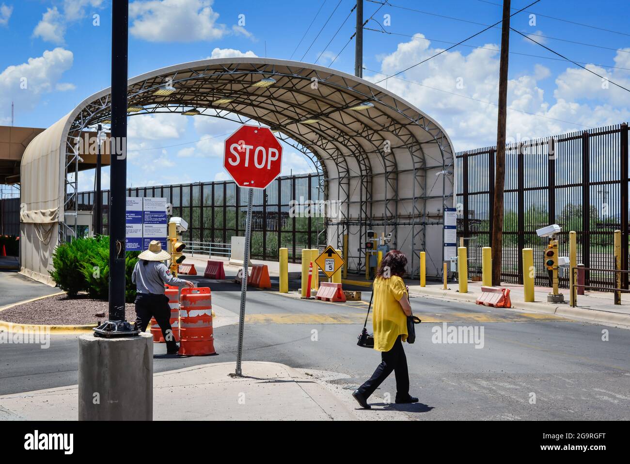 woman in crosswalk at US Customs and Border protection crossing at Douglas, AZ,  Port of Entry on the Mexico-US border with Agua Prieta, Sonora, MX Stock Photo