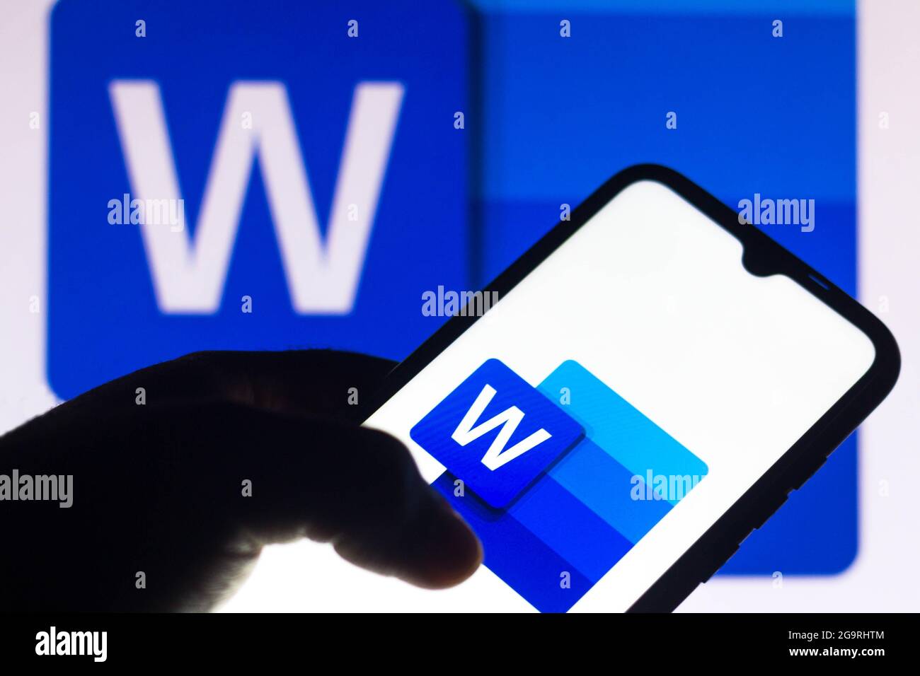 Brazil. 27th July, 2021. In this photo illustration the Microsoft Word logo seen displayed on a smartphone and in the background. (Credit Image: © Rafael Henrique/SOPA Images via ZUMA Press Wire) Stock Photo