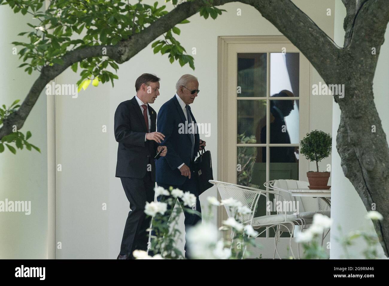 Mclean, United States. 27th July, 2021. U.S. President Joe Biden walks into the Oval Office with Jake Sullivan, National Security Advisor, as Biden returns to the White House after traveling to the Office of the Director of National Intelligence on Tuesday, July 27, 2021 in Washington, DC Photo by Alex Edelman/UPI Credit: UPI/Alamy Live News Stock Photo