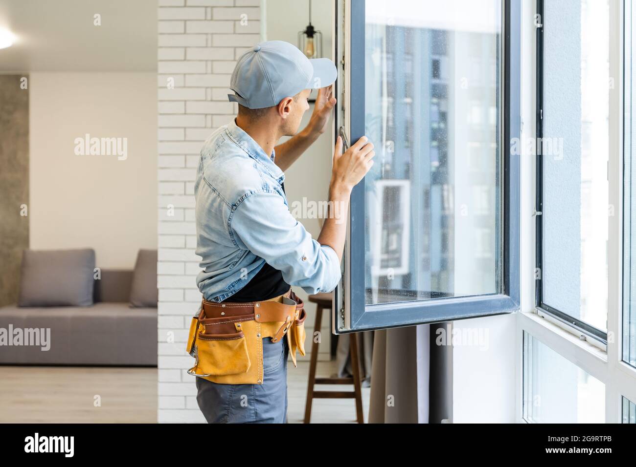 Young Handyman Male Worker Repair Window Stock Photo Alamy