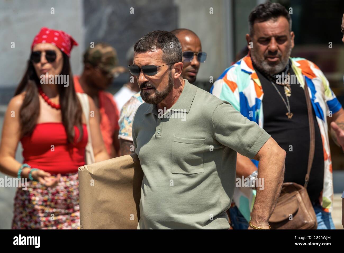 Thessaloniki, Greece - July 3, 2021. Spanish actor, Antonio Banderas (C), during the filming of the action thriller, The Enforcer, in the streets of T Stock Photo