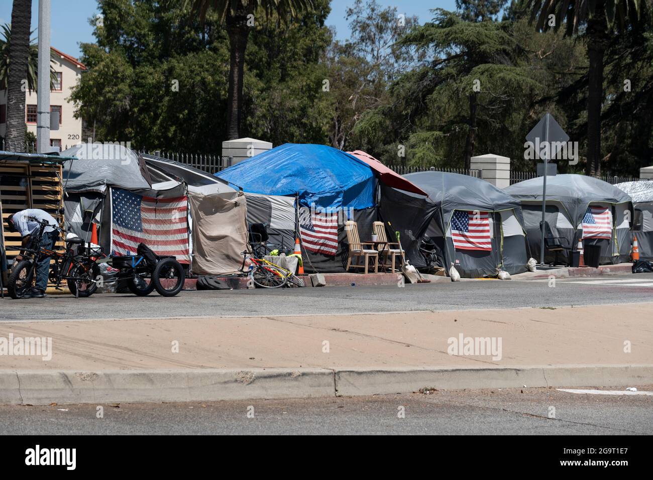 Los Angeles, CA USA - Julyl 3, 2021: Row of tents for homeless veterans surrounding the permieter of the Veterans Administration  and Hospital grounds Stock Photo