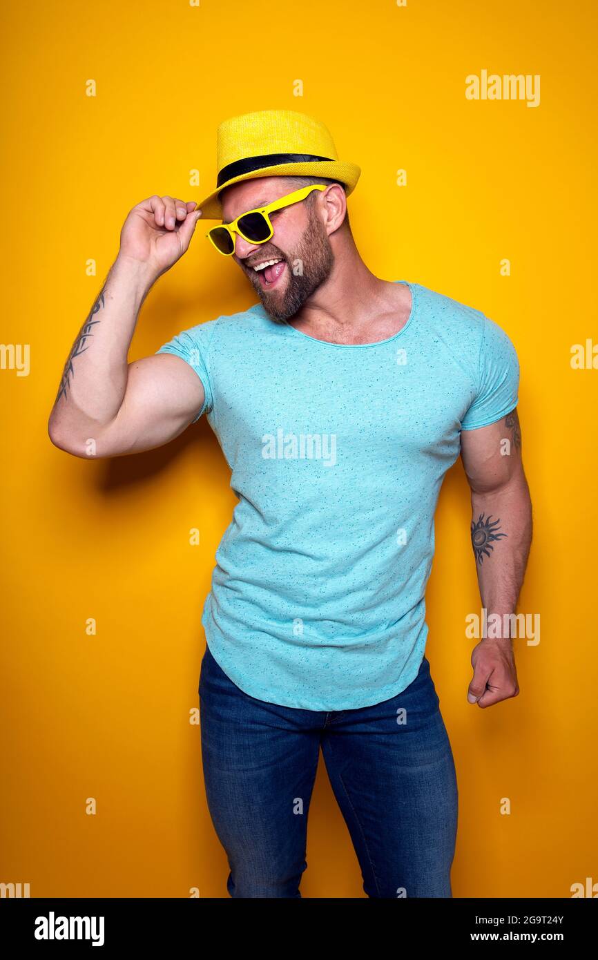 Man in bright yellow shirt hi-res stock photography and images - Alamy