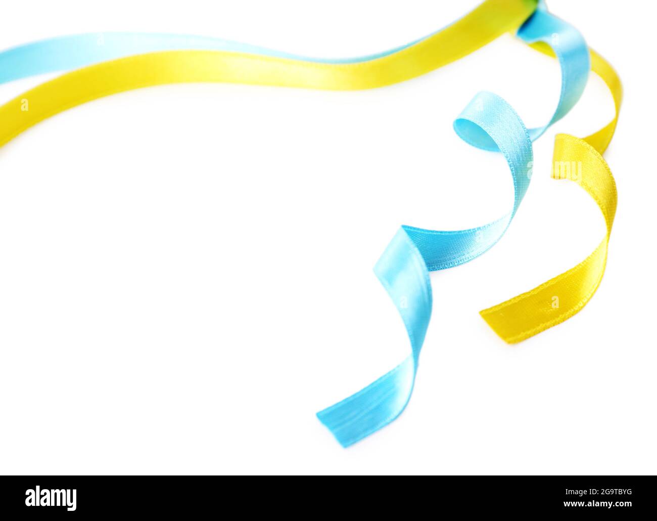 Colorful blue and yellow ribbons isolated on white Stock Photo - Alamy