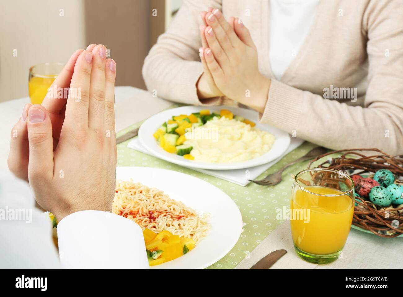 People praying before eating Stock Photo Alamy
