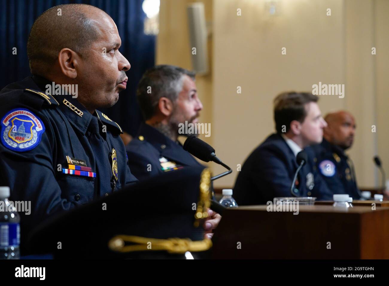 WASHINGTON, July 27, 2021 (Xinhua) -- U.S. Capitol Police officer Aquilino Gonell, Washington Metropolitan Police Department officer Michael Fanone, Washington Metropolitan Police Department officer Daniel Hodges and U.S. Capitol Police sergeant Harry Dunn (from L to R) testify during a U.S. House select committee hearing on the Jan. 6 Capitol riot in Washington, DC, the United States, on July 27, 2021. A U.S. House panel dedicated to investigating the Jan. 6 Capitol riot kicked off its much-anticipated first hearing Tuesday featuring four police officers who defended the seat of Stock Photo