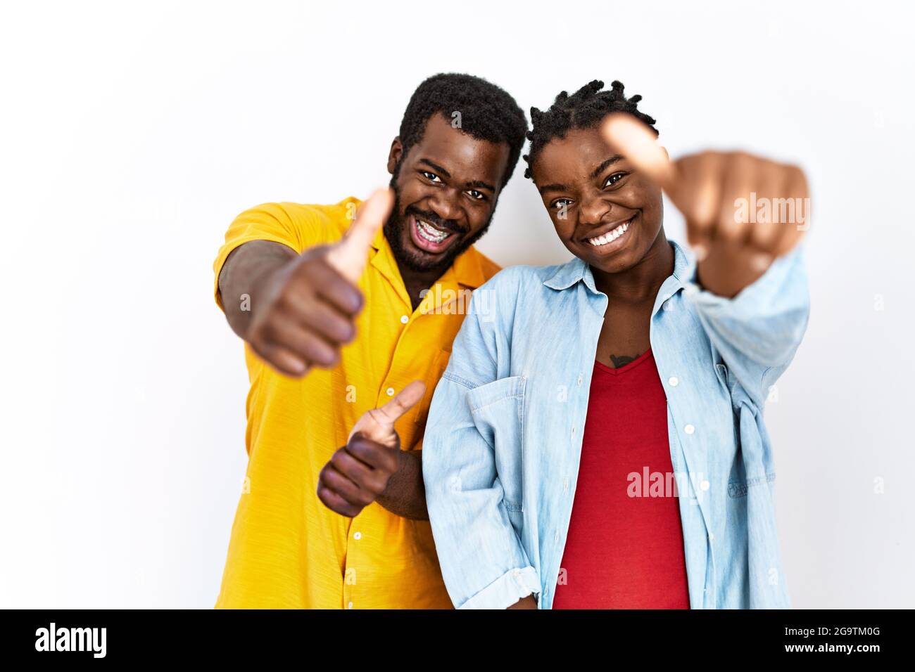 Young african american couple wearing casual clothes approving doing ...