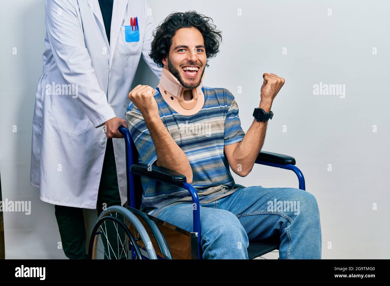 Handsome Hispanic Man Sitting On Wheelchair Wearing Neck Collar 