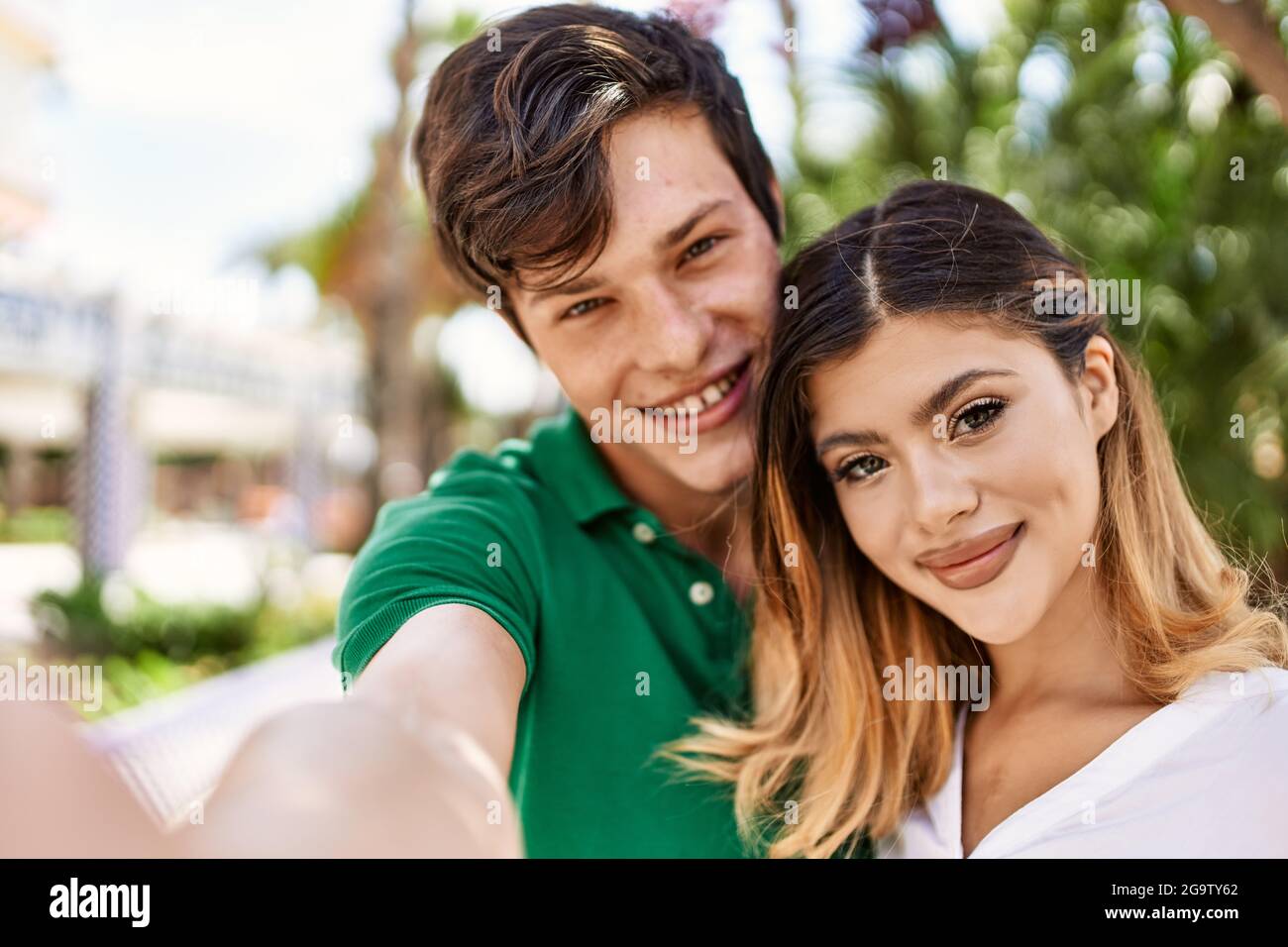 Young caucasian couple smiling happy and hugging make selfie by the ...
