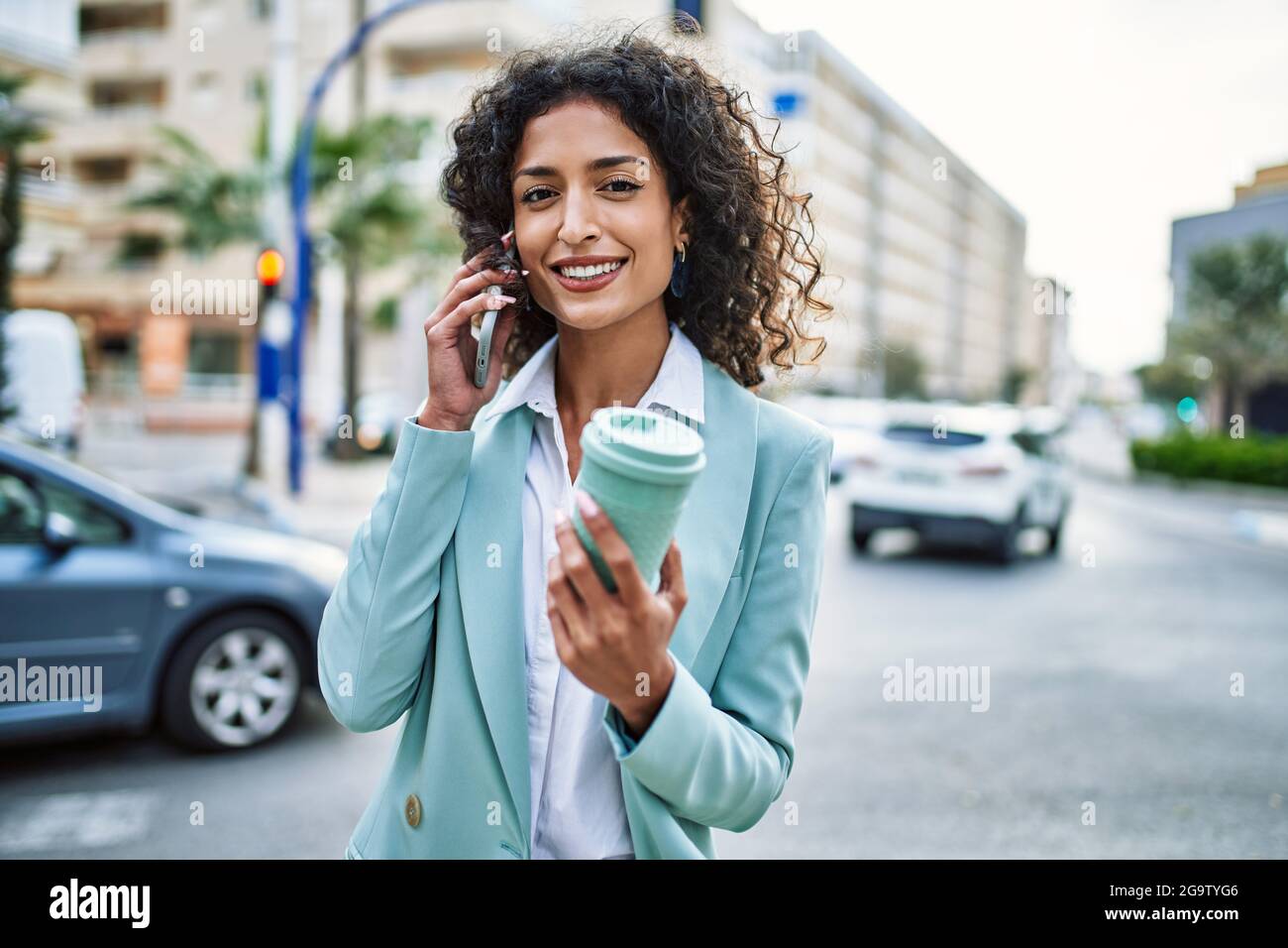 Young hispanic business woman wearing professional look smiling ...