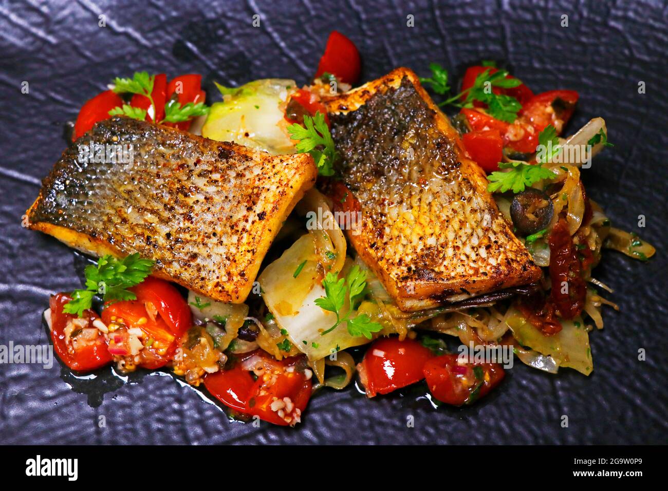 pan fried sea bass fillet with mediterranean style sauteed fennel