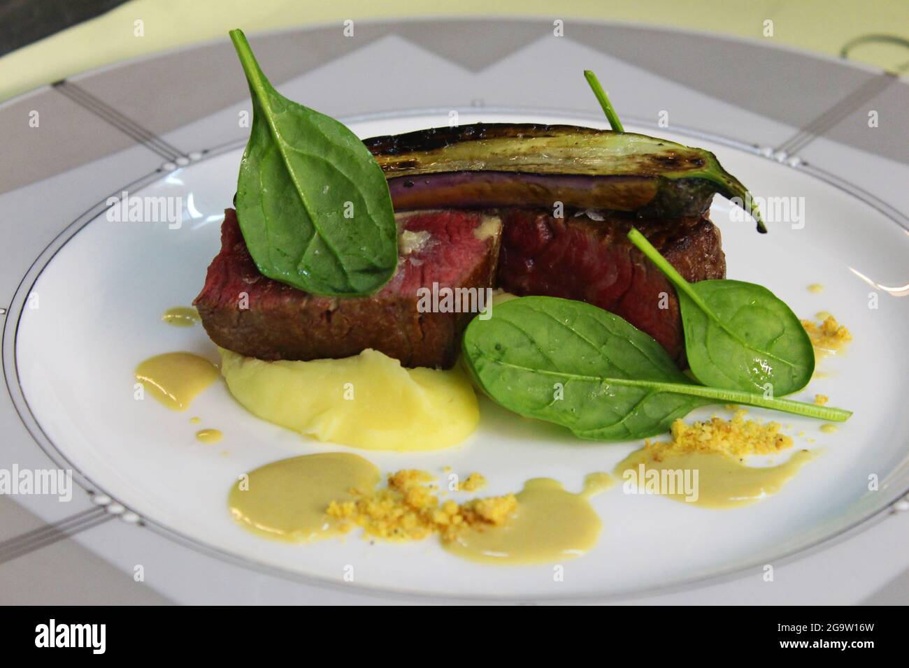 american angus grilled tenderloin with eggplant, spinach and potato puree Stock Photo