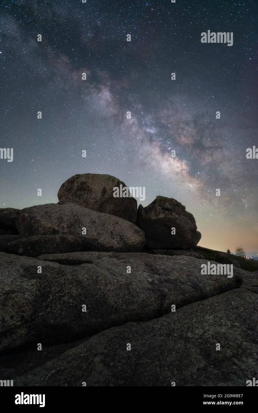 The Milky Way arching over the granite boulders of Old Rag Mountain in ...