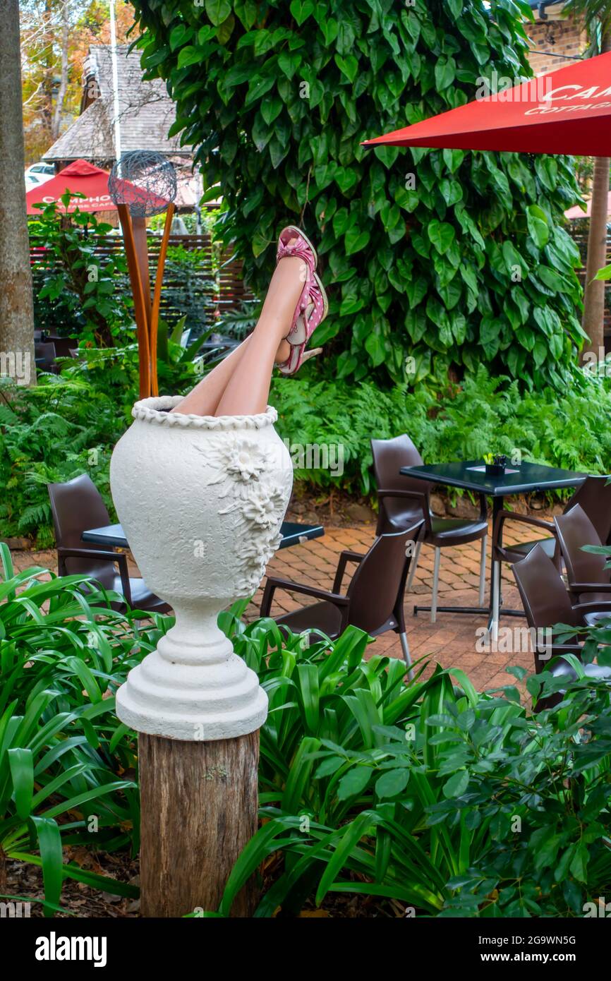 Manikin legs on display in tropical garden,Australia, Stock Photo