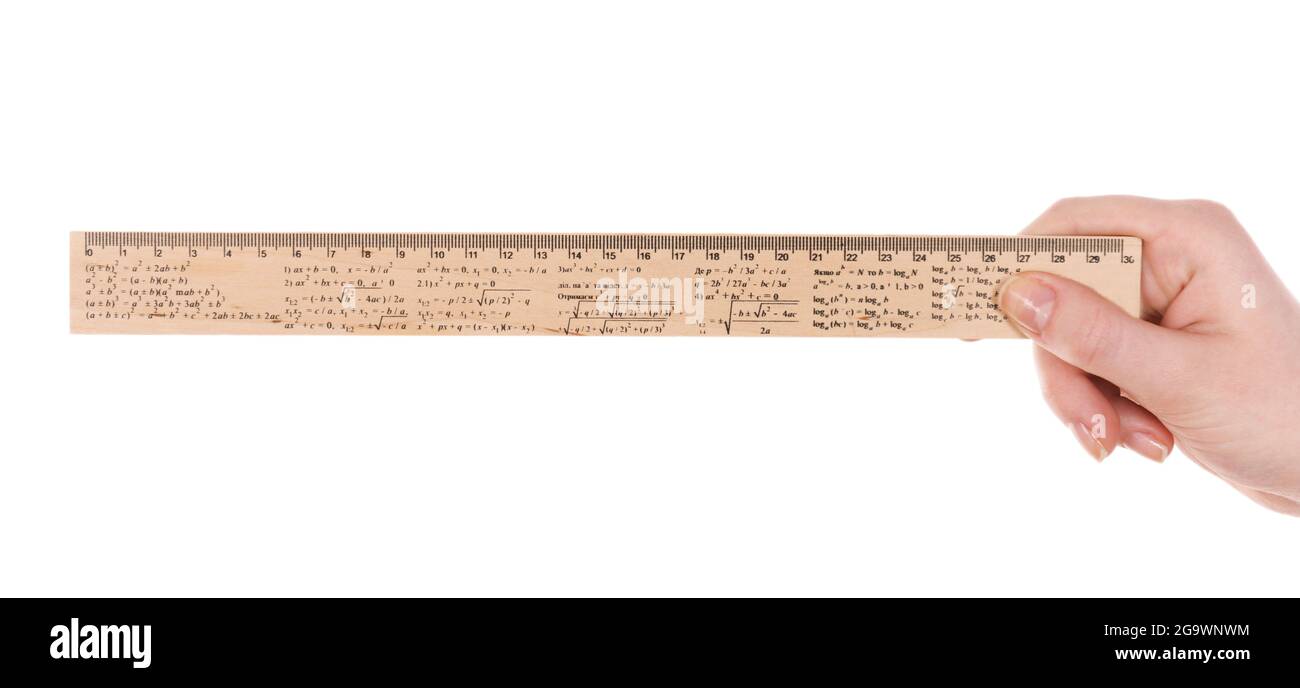 Female hand with wooden ruler isolated on white Stock Photo - Alamy