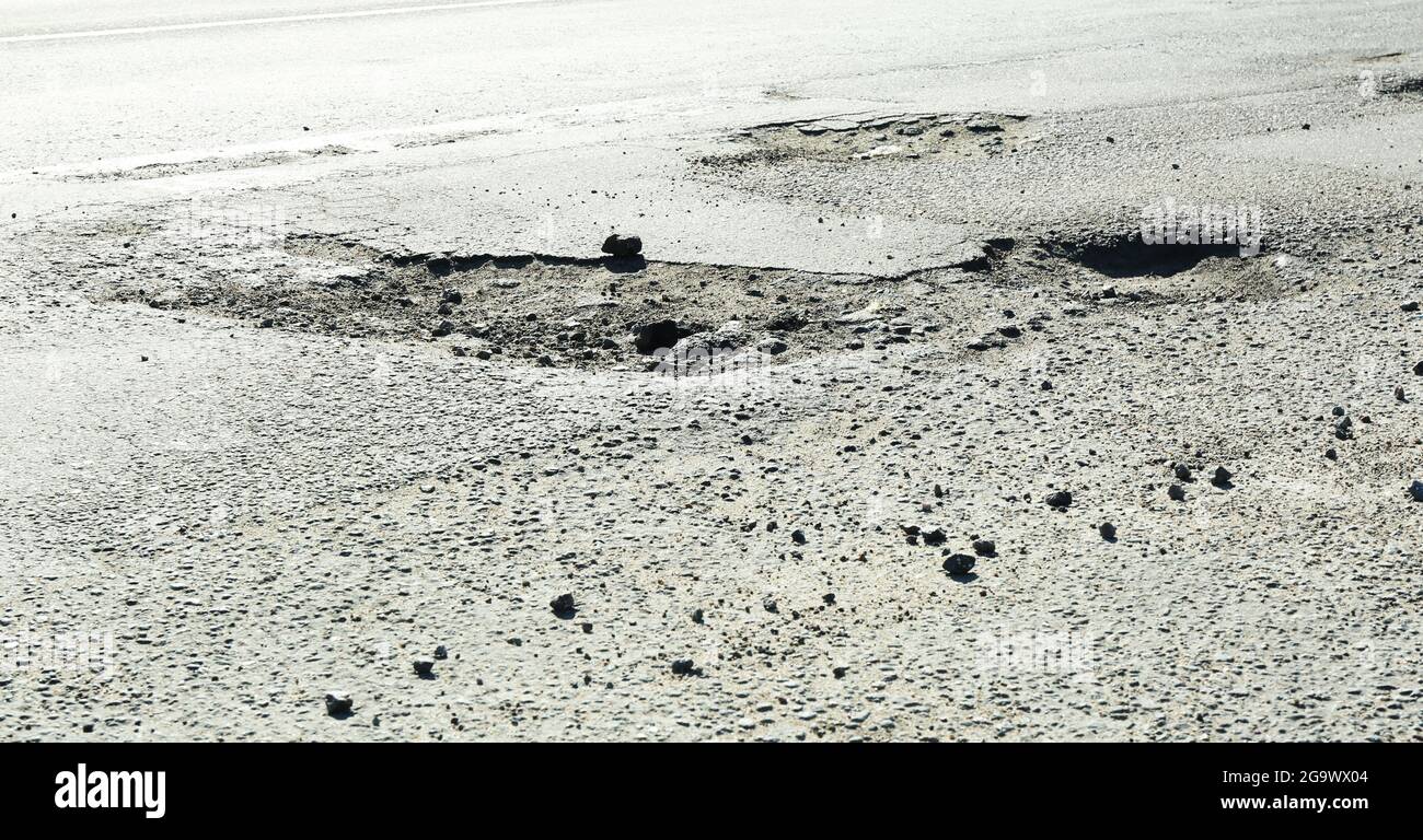 Very bad quality road with potholes Stock Photo Alamy