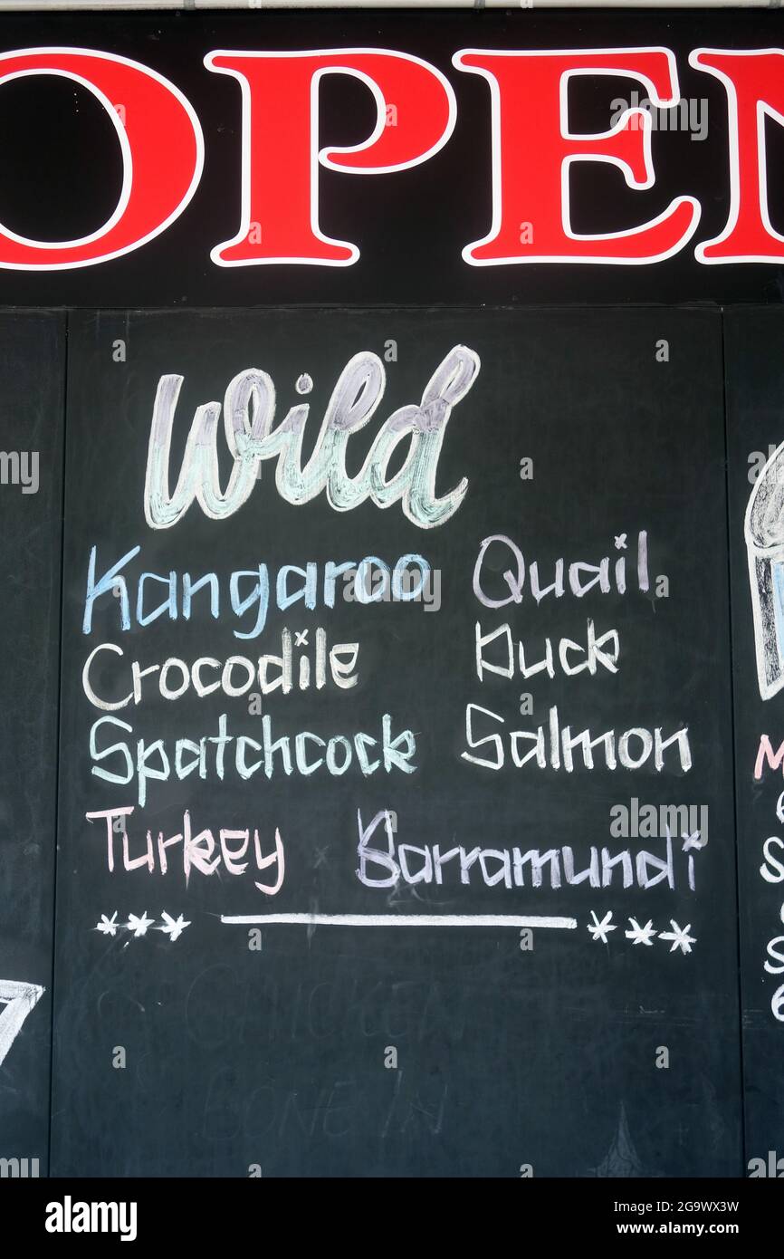 Local butcher sign showing wild caught meats available today, Cairns, Queensland, Australia. No PR Stock Photo