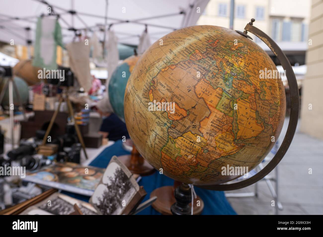 Old globe on stand of antiques market in Arezzo Italy Stock Photo