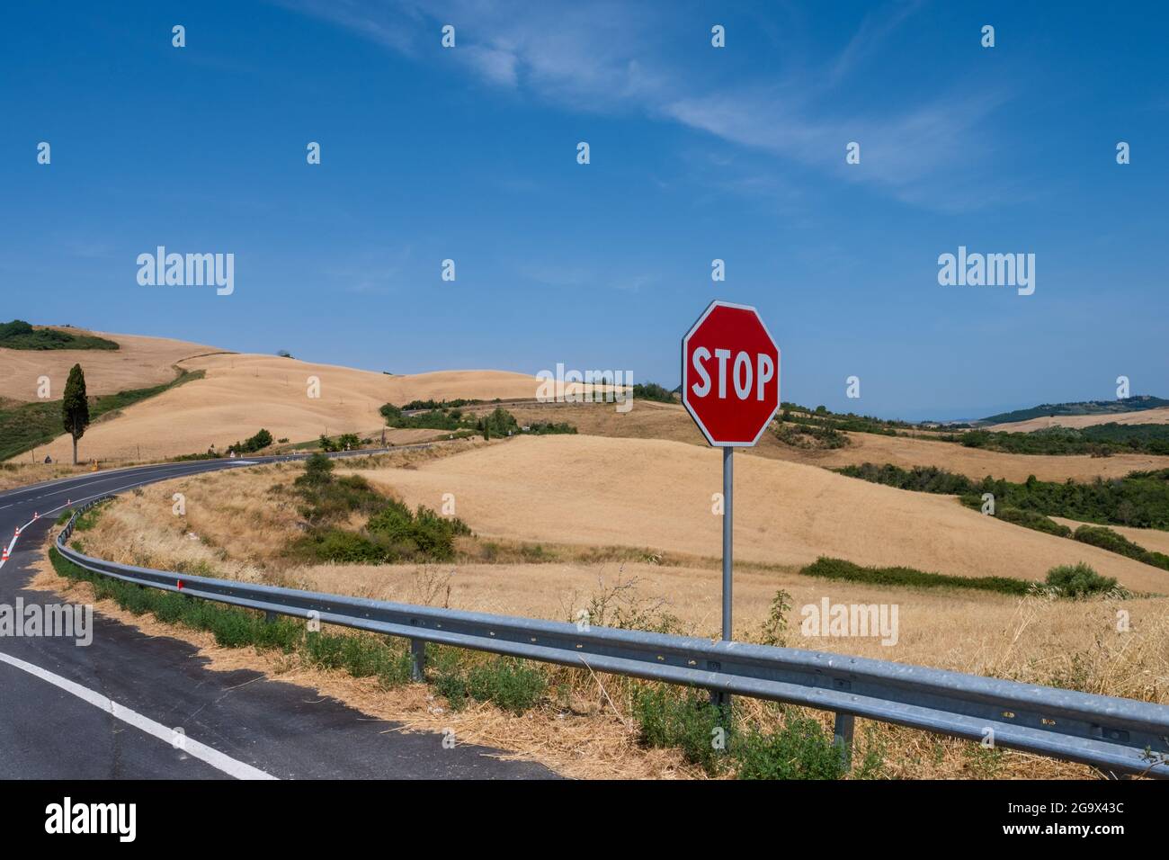 Stop road sign on hill of Tuscany Italy Stock Photo