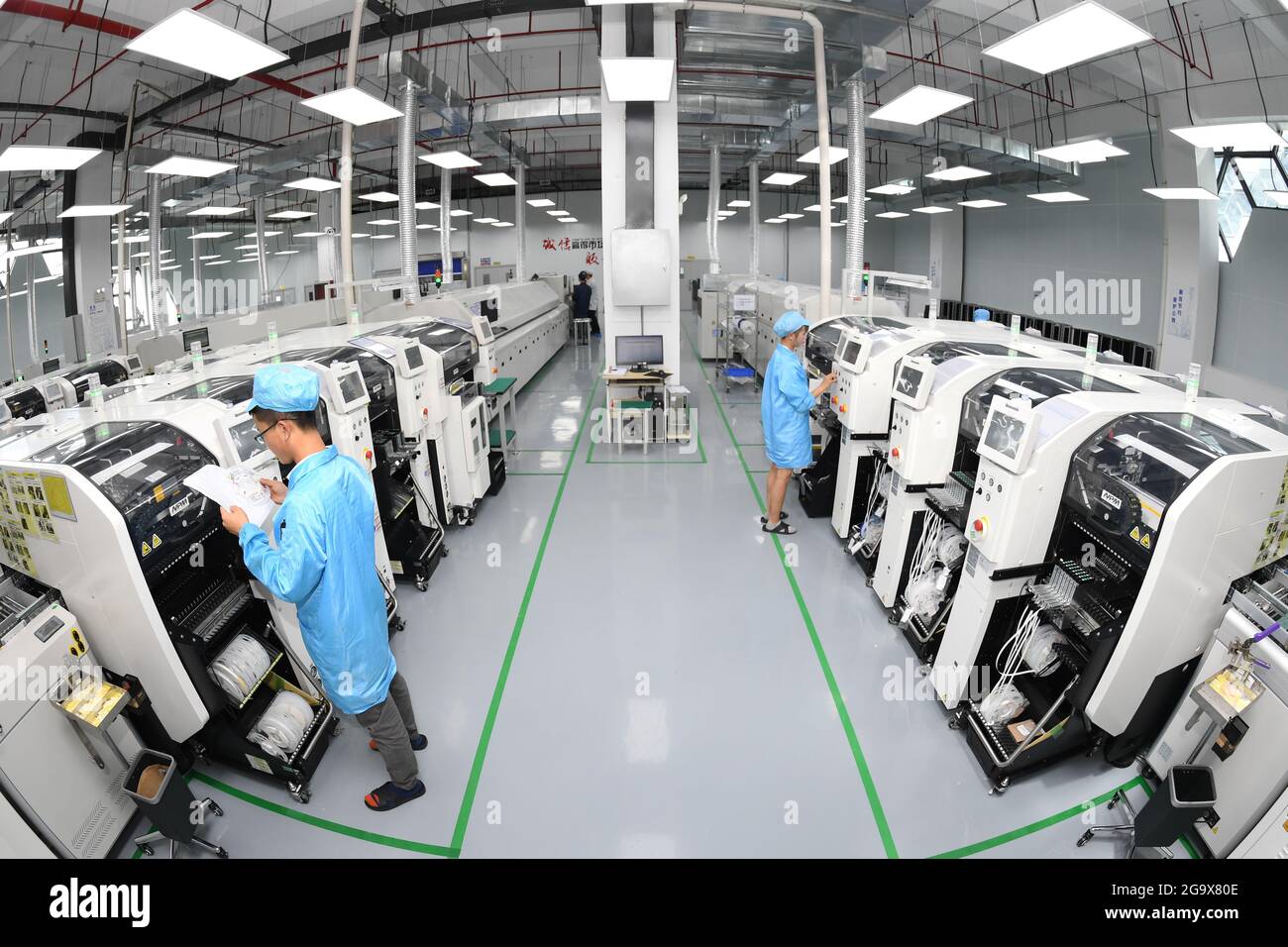 GUIYANG, CHINA JULY 27, 2021 Workers work on a Panasonic SMT
