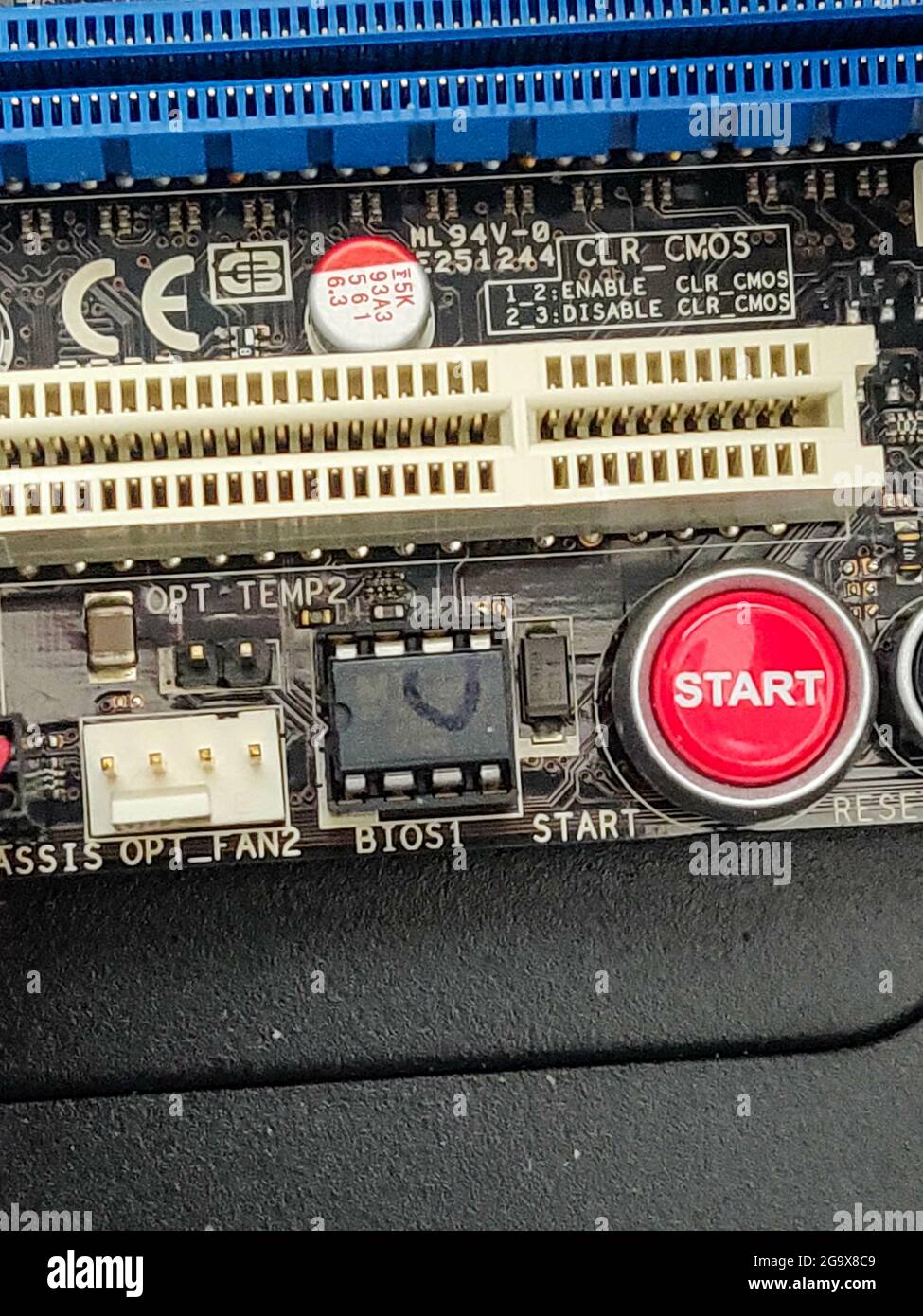 Vertical shot of a red start button on a motherboard Stock Photo - Alamy